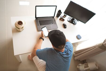Young man having Zoom video conferencing call via computer. Home office. Stay at home and work from...