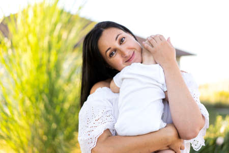 mom and son in a beautiful field are played, freedom conceptの写真素材