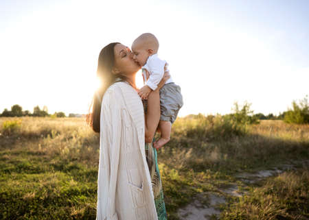 mom and son in a beautiful field are played, freedom conceptの写真素材