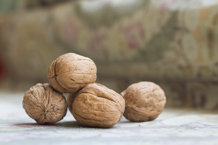 Walnuts close-up with green background