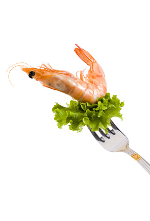 Shrimp on fork with lettuce isolated on whiteの写真素材