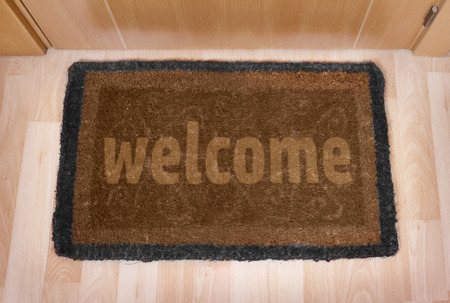 Welcome home on brown mat の写真素材
