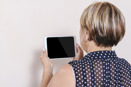 Senior woman using digital tabletの写真素材