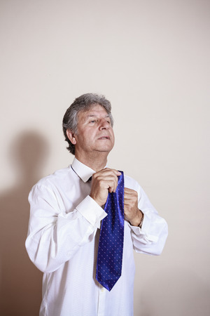 Senior business man wear a tie.の写真素材
