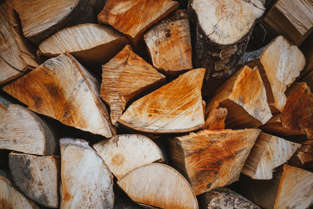 Firewood with mountains in the backgroundの写真素材