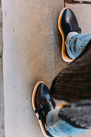 View of woman shoe with blue jeansの写真素材