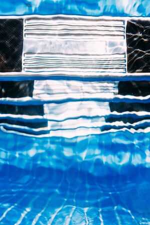 Blue ripped water in swimming poolの写真素材