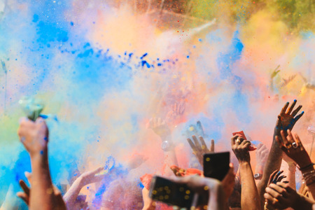 Celebrants dancing during the color Holi Festivalの写真素材