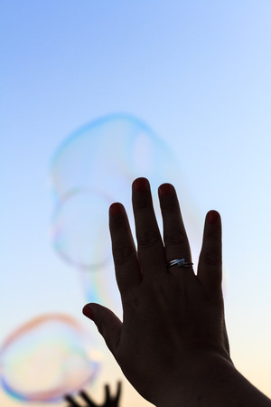 Bubbles and handの写真素材