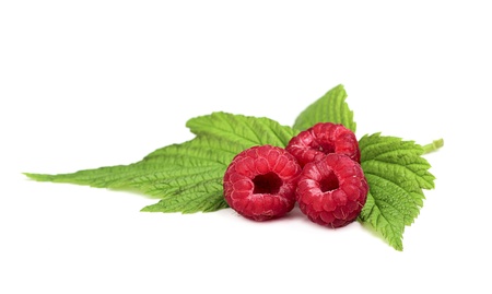 Fresh raspberries with leaves?isoleted on a white background.