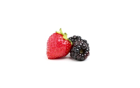 Strawberries and blackberries close-up on white background.の写真素材