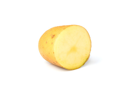 Half of the potato closeup isolated on white background.の写真素材