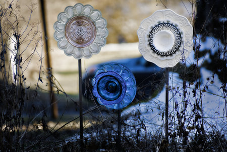 Ceramic objects in in a flower bed.の写真素材