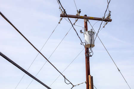 High voltage electricity pole with power linesの写真素材