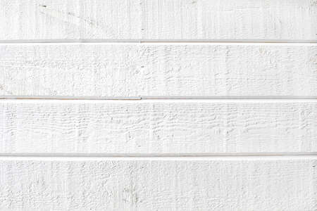 White painted textured wooden wallの写真素材