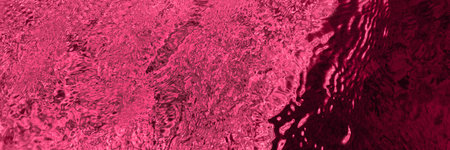 Viva magenta ripples and light reflections abstractの写真素材