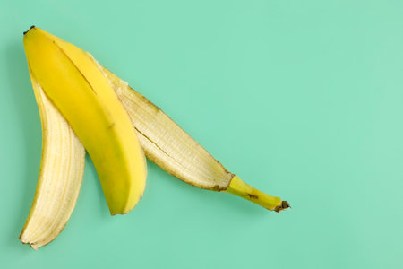 Banana peel on aqua mint green