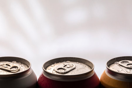 Three cans with a drinkの写真素材