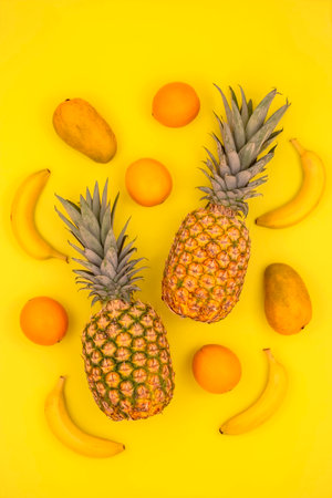 Tropical fruits on yellowの写真素材