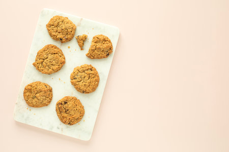 Oatmeal cookies on white marble and pink background