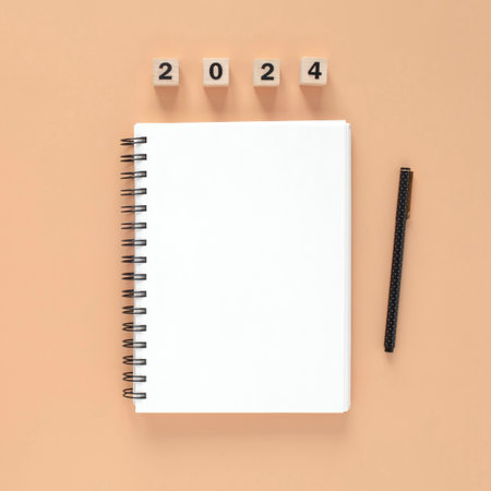 Blank journal for 2024 on peach color backgroundの写真素材