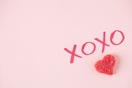 XOXO sign and a red heart candyの写真素材