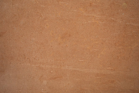 Natural clay tile surface with warm earthy tones and subtle texture. Rustic ceramic background ideal for architecture, interior design, flooring, and Mediterranean style concepts.の写真素材