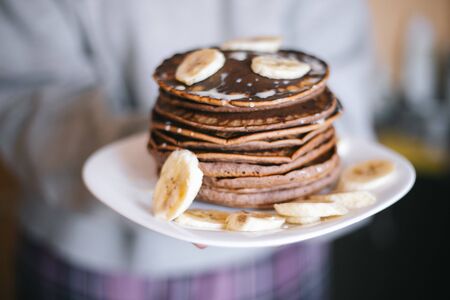 Chocolate pancakes with bananas and cocoa