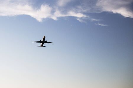 Airplane on a background of blue sky. The plane is landing. The plane takes off.の写真素材