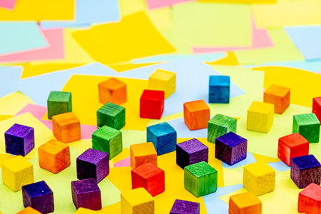 Colorful wood block with a background of multicolored paper sticky notes