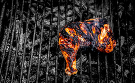 chicken leg fried on the charcoal barbecue grill