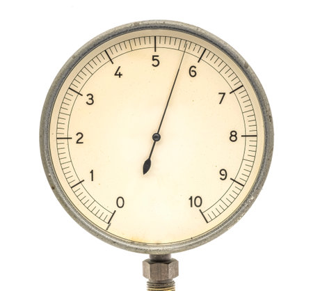 Old vintage pressure gauge on a white background