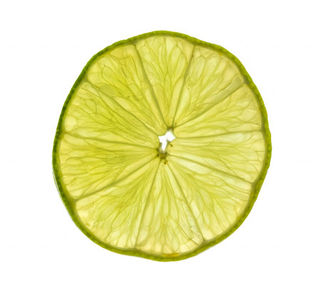 Close up in backlight of a slice of green lemon