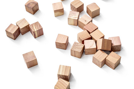 Wooden toy cubes on white