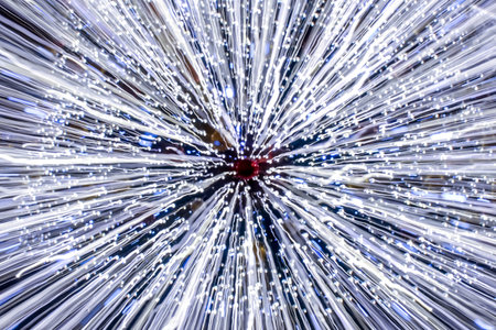 Abstract defocus motion curved lights on dark backgroundの写真素材