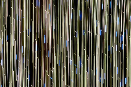 Abstract defocus motion curved lights on dark backgroundの写真素材