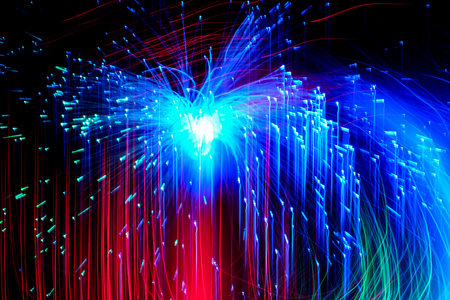 Abstract motion curved lights on dark backgroundの写真素材