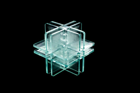 abstract green plastic shape on black backgroundの写真素材