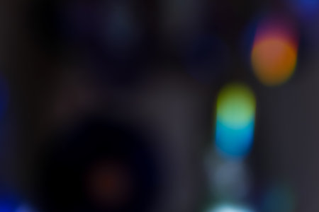 Abstract motion defocused lights on dark backgroundの写真素材
