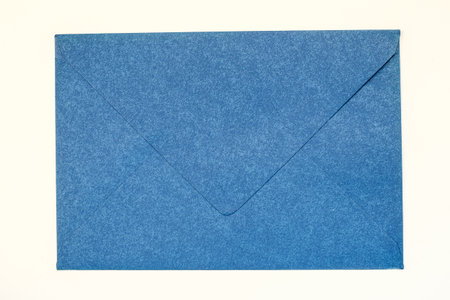 blue vintage paper envelope isolated on the whiteの写真素材