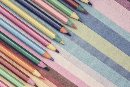 colored pencils on colored paper backgroundの写真素材