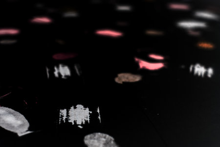 fingerprint and stamp on black paperの写真素材