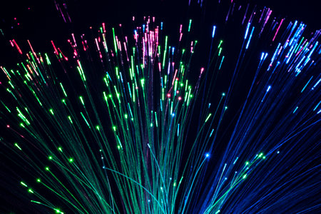 Optical fiber network cable on dark background.の写真素材