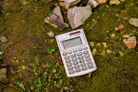 old pocket computer thrown in the waterの写真素材