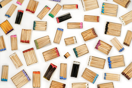 multicolored match sticks in boxes on a white backgroundの写真素材