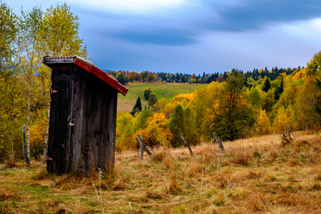 Colorful autumn landscape in the Romanian Carpathians, Fantanele village, Sibiu county, Cindrel mountains, 1100m, Romaniaの写真素材