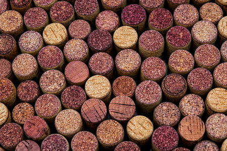 Old Used corks plugs from various types of wine on dark backgroundの写真素材