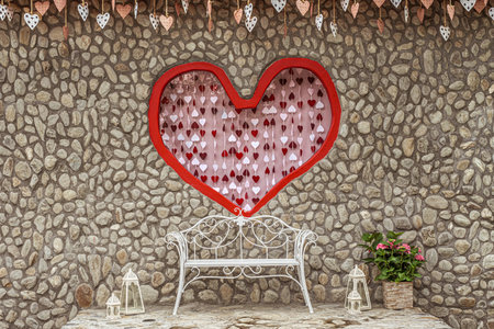 love scene backdrop For taking pictures with an iron bench and a stone background frame with a red heart in the centerの写真素材