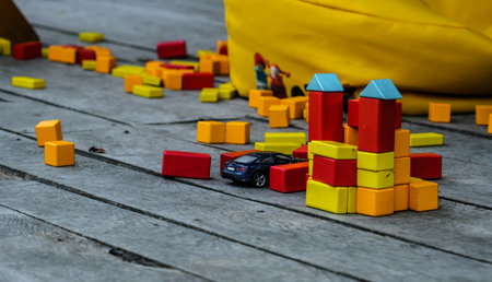 colorful wooden toys on the table in the yardの写真素材
