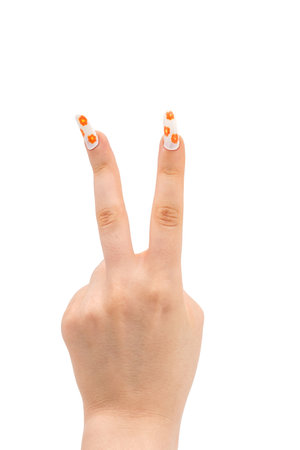 Young Woman hand is show two fingers up isolated on white background. Finger symbols of peace strength fight, victory symbol, letter V in sign language or number two or second.の写真素材